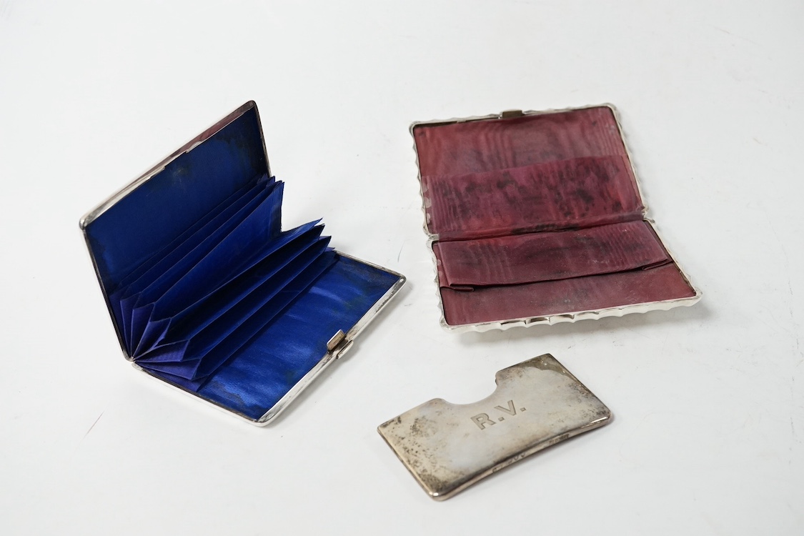 A late Victorian engraved silver card purse, by William Summers, London, 1880, 10cm, together with a similar wrythened silver card purse, Birmingham, 1892 and a small late Victorian silver card case. Condition - fair to